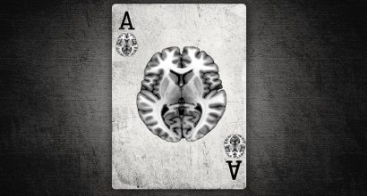Black and white picture of a playing card with a picture of brain on the card.