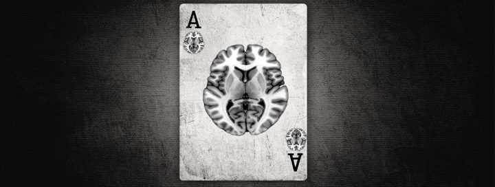 Black and white picture of a playing card with a picture of brain on the card.