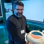 Aleksandras Kaupas offering the HAZARD cake – photo Lauri Ojala