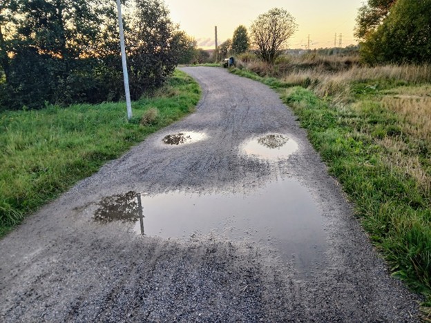 Gravel pathway with puddles