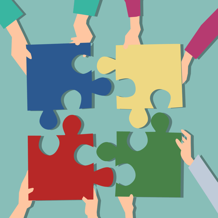 Ihmiset ojentavat palapelin palaset keskelle, jolloin ne sopivat yhteen.