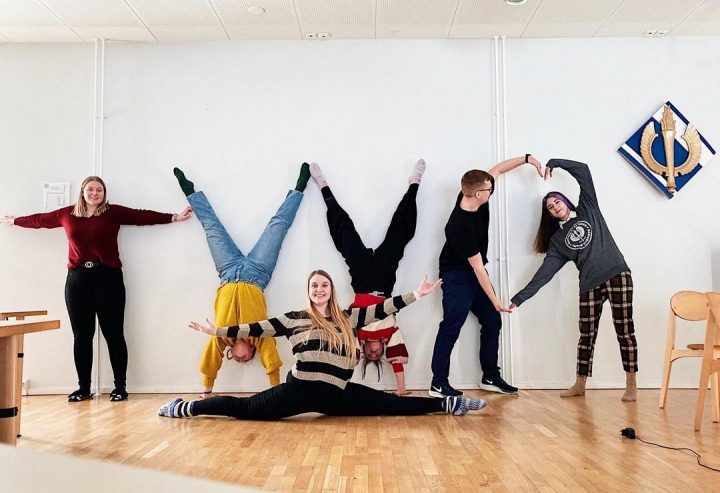 Student Union of the University of Turku board members show letters TYY.