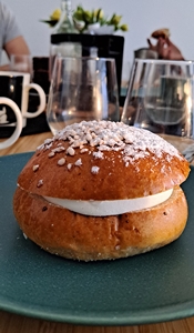 Image showing a plate with a Finnish sweet pastry, traditionally made with whipped cream and raspberry jam.