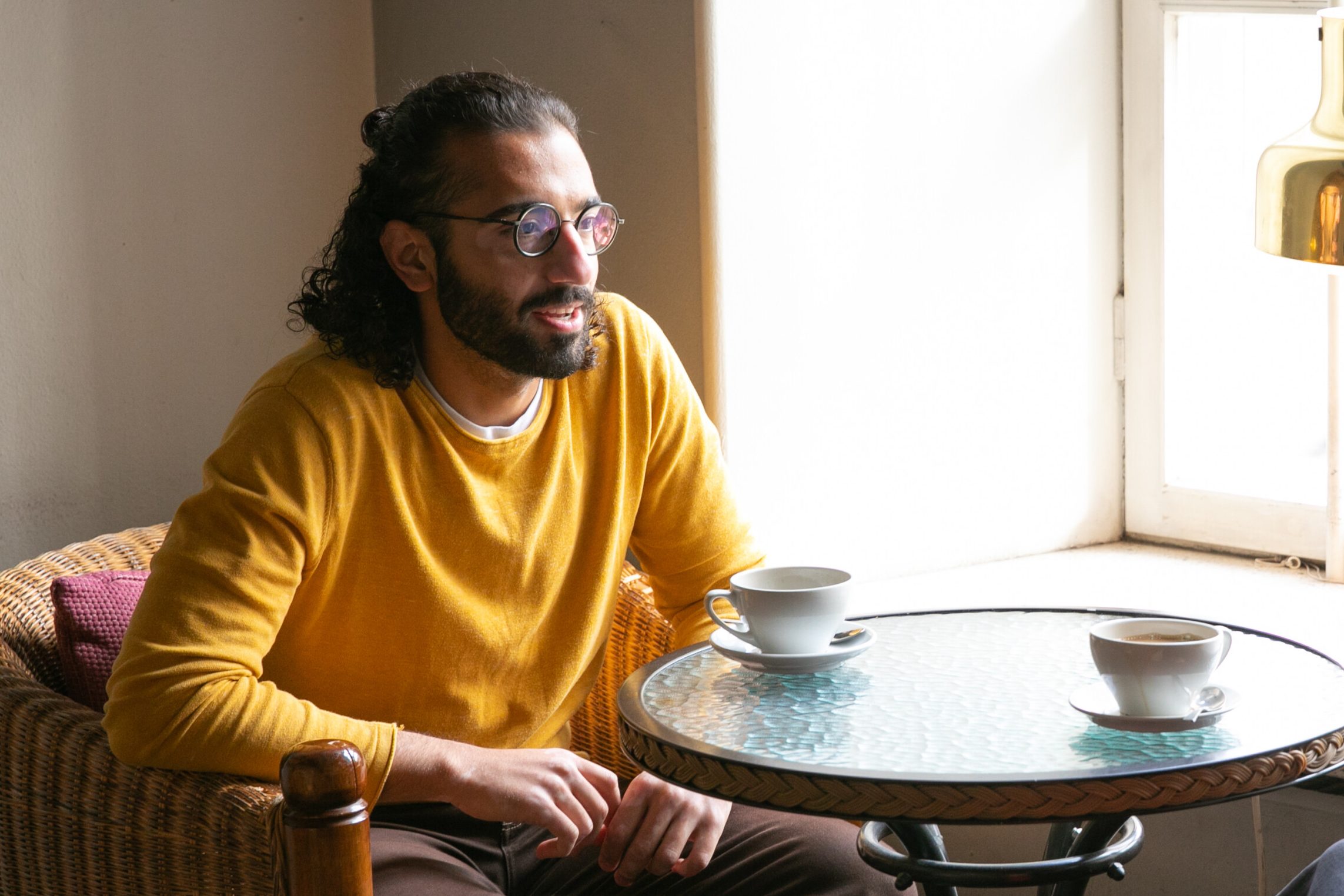  Mahdi Moghaddam in a cafe.