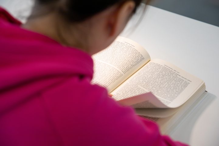 A student reading an English book