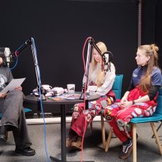 Student ambassador is interviewing two student organisation representatives in a podcast studio
