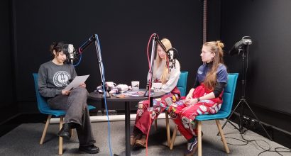 Student ambassador is interviewing two student organisation representatives in a podcast studio