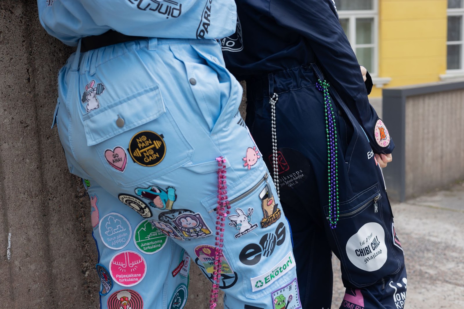 Close up of patches and chains on student overalls