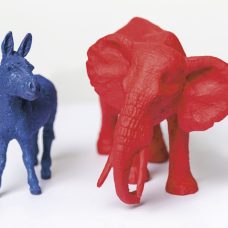 A photo of a blue toy-donkey and a red toy-elephant.