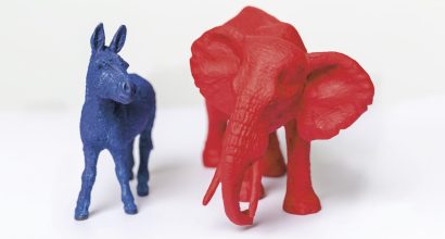 A photo of a blue toy-donkey and a red toy-elephant.